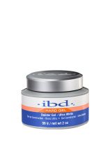 A 2-ounce grey plastic tub of ibd Ultra White Builder Gel with a blue, white, & orange themed product label