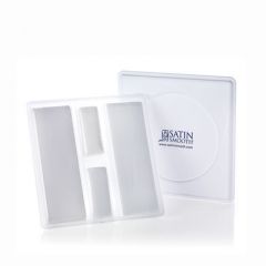 Propped up Satin Smooth Waxing Strip Tray and lid featuring included Muslin & Non-Woven waxing strips in 4 compartments