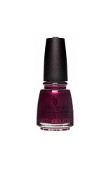 Capped 0.5-ounce bottle of nail polish in Royal pain in the ascot variant isolated in white background