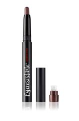 Close-up of an uncapped Ardell Eyeresistible Shadow Stick Unfriendly Skills Dark Chestnut with cap & sharpener